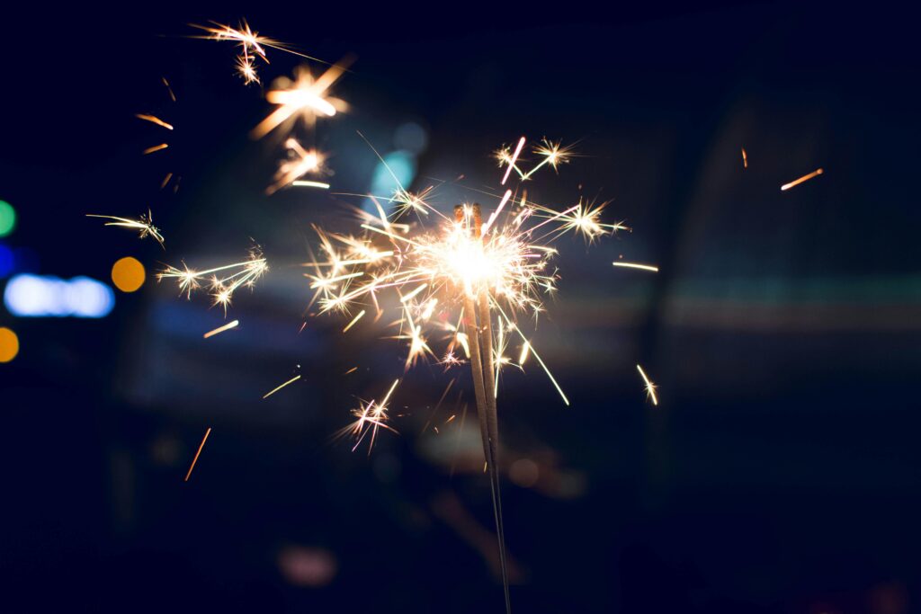 Person Holding Lighted Firecracker